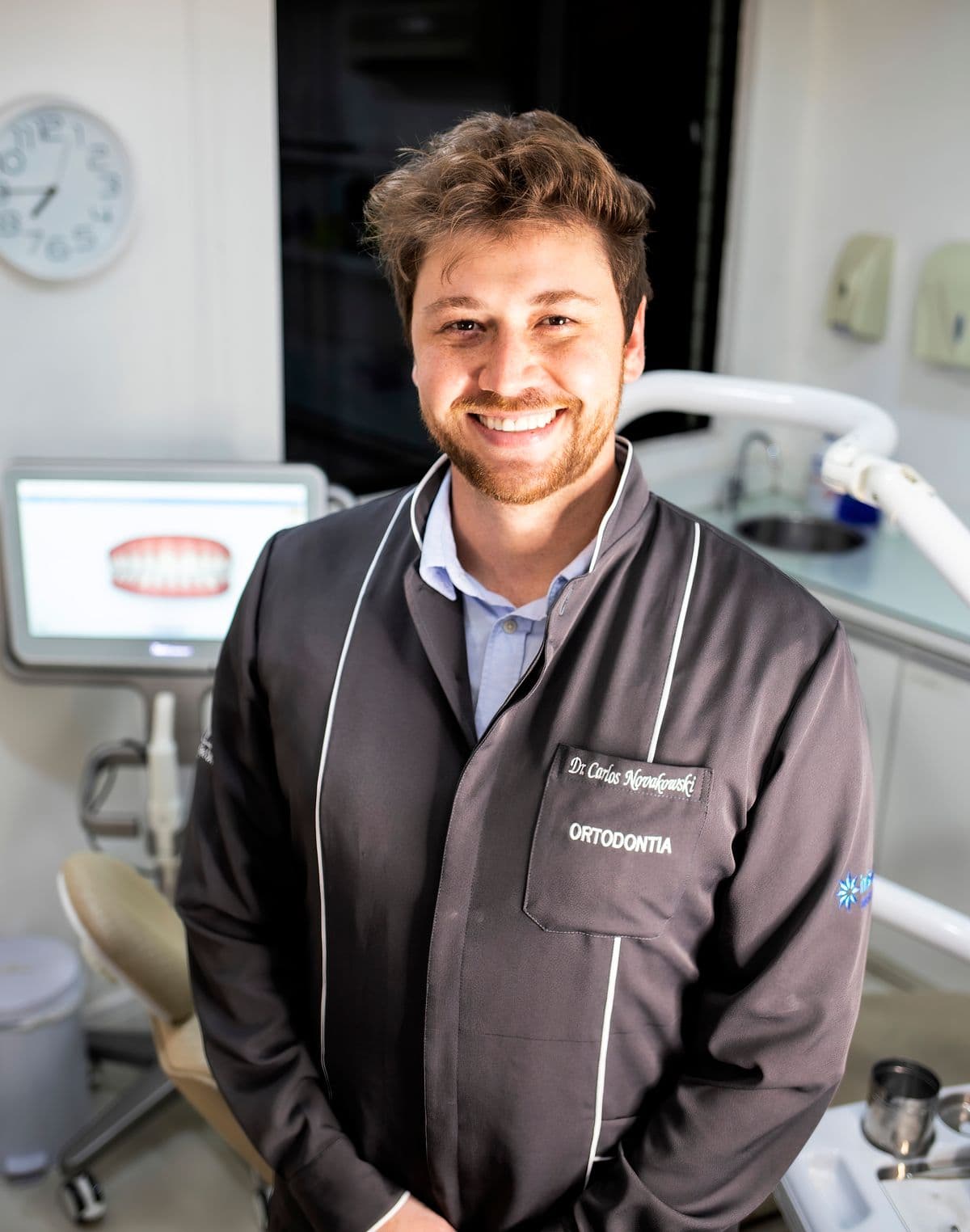 Smiling orthodontist photographed in a dental clinic